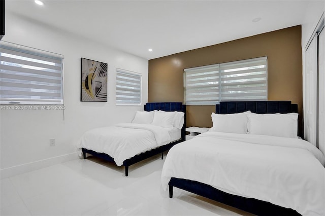 bedroom featuring a closet and multiple windows