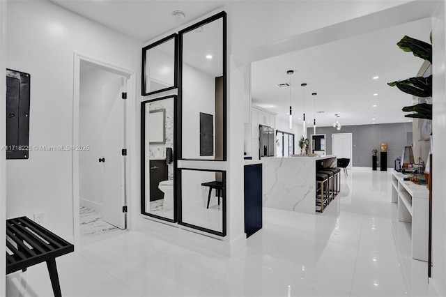 corridor with light tile patterned floors