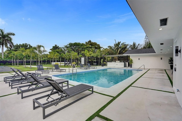 view of swimming pool with a patio area