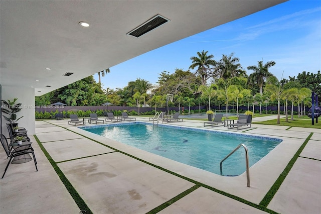 view of swimming pool featuring a patio area