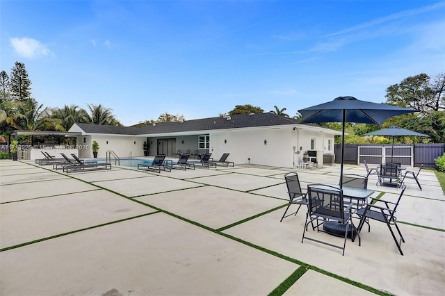 view of patio with a community pool