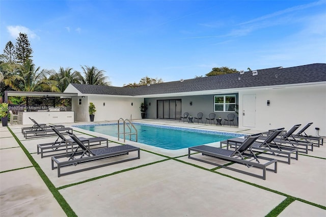 view of swimming pool featuring a patio area