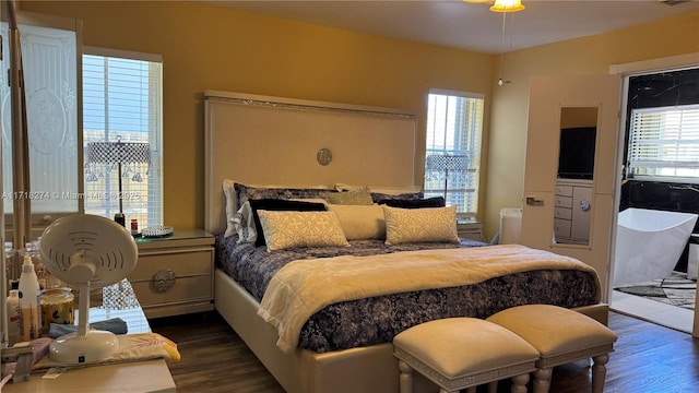 bedroom featuring dark hardwood / wood-style flooring