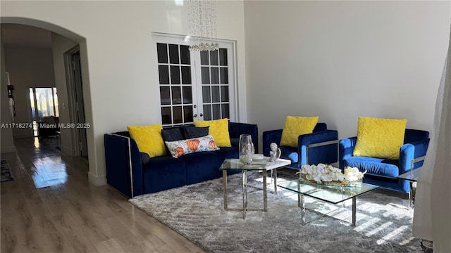 living room with french doors and hardwood / wood-style flooring