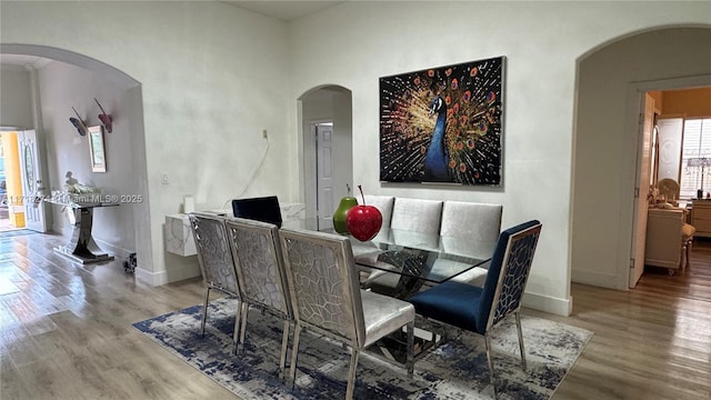 dining area with light hardwood / wood-style flooring