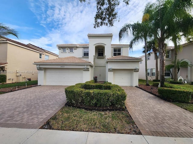 mediterranean / spanish-style home featuring a garage