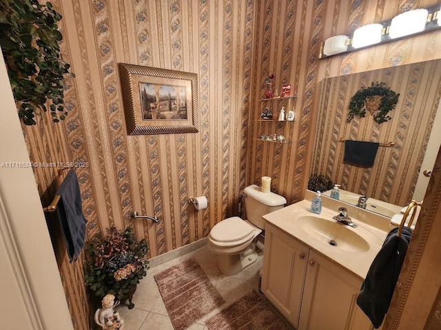 bathroom featuring tile patterned flooring, vanity, and toilet