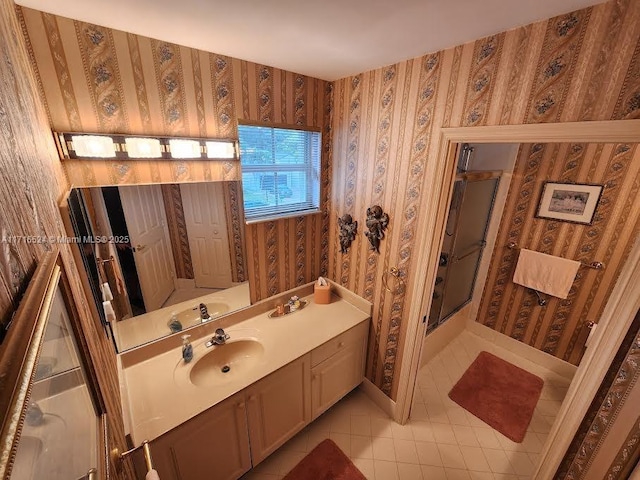 bathroom featuring tile patterned floors, vanity, and walk in shower