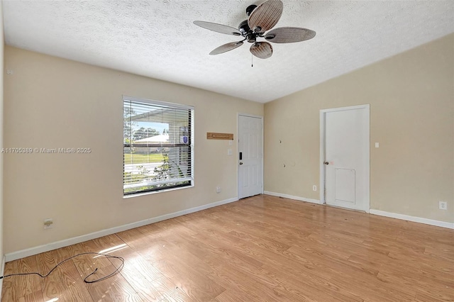 unfurnished room featuring a textured ceiling, ceiling fan, and light wood-type flooring