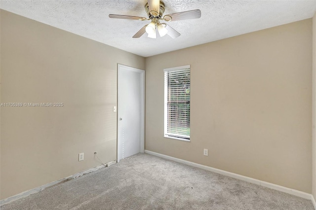 unfurnished room with light carpet, ceiling fan, and a textured ceiling