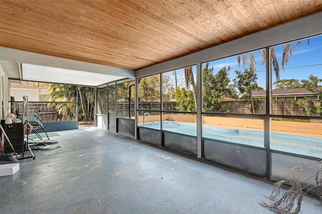 unfurnished sunroom with wooden ceiling