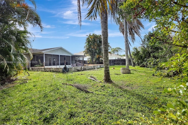 view of yard featuring a sunroom