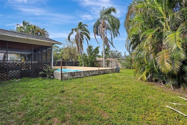 view of yard with a sunroom