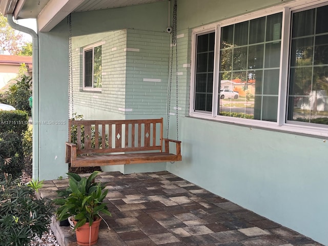 entrance to property featuring covered porch