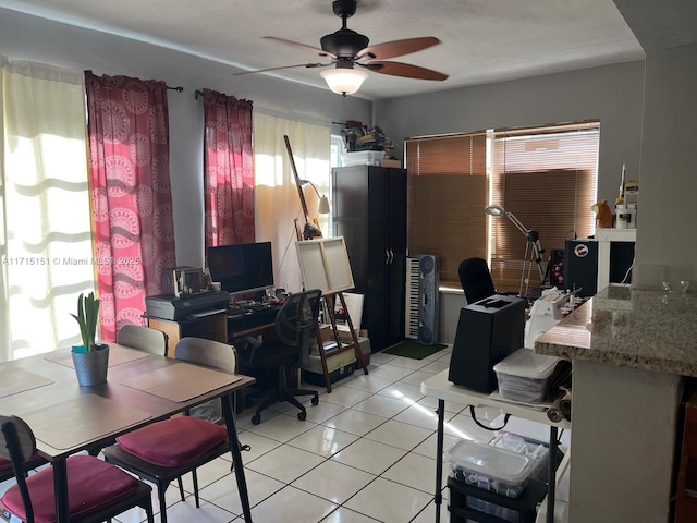 tiled office space with ceiling fan