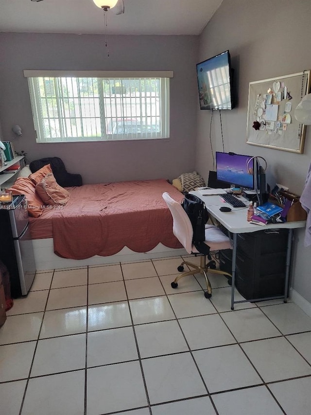 bedroom with tile patterned floors and ceiling fan