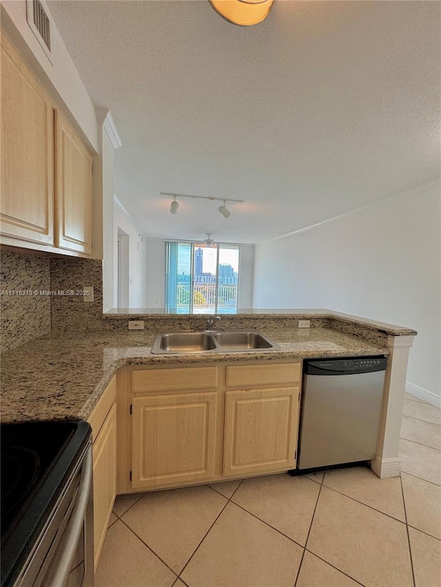 kitchen with light tile patterned floors, light brown cabinets, visible vents, a sink, and appliances with stainless steel finishes