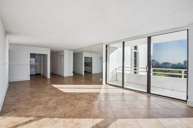20355 NE 34th Ct Unit 1828, Aventura, FL 33180 - unfurnished room with floor to ceiling windows and a view of city