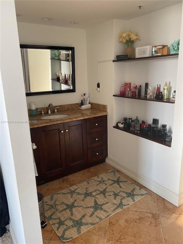 bathroom with tile patterned flooring and vanity