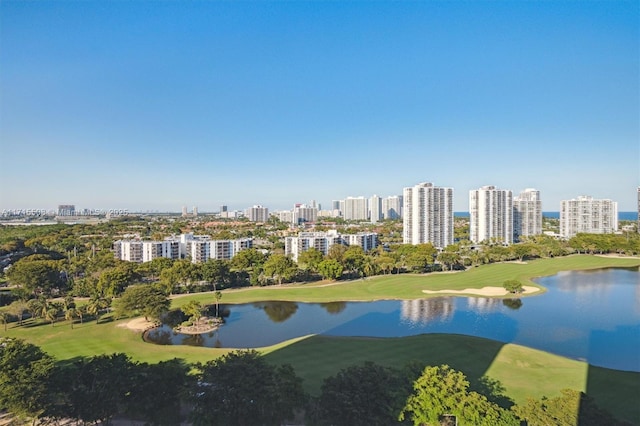 drone / aerial view featuring a view of city and a water view