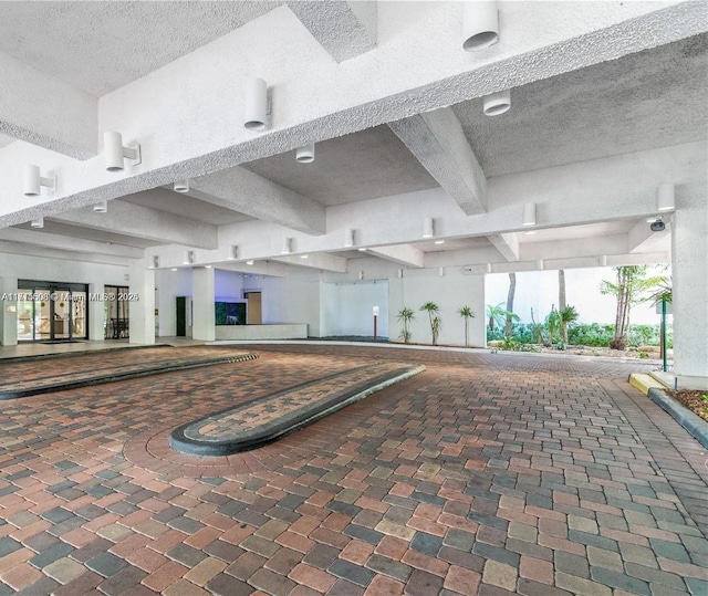 20355 NE 34th Ct Unit 1828, Aventura, FL 33180 - interior space featuring beamed ceiling and a textured ceiling