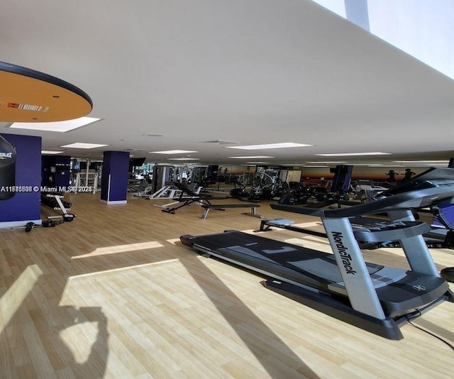 workout area with wood finished floors and visible vents