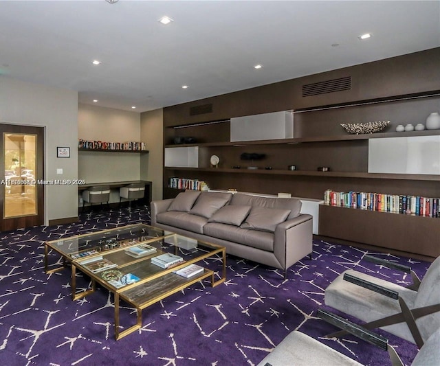 living area featuring carpet, visible vents, and recessed lighting