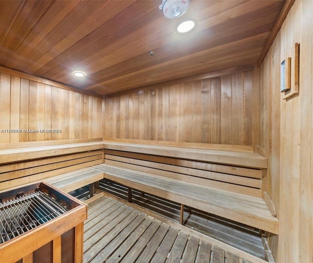 20355 NE 34th Ct Unit 1828, Aventura, FL 33180 - relaxing sauna with wooden walls, wood ceiling, and recessed lighting