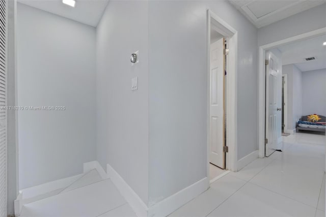 corridor with light tile patterned floors