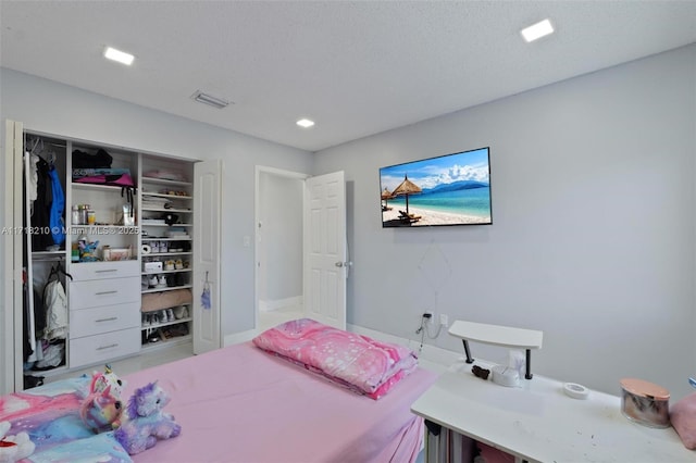 bedroom featuring a textured ceiling