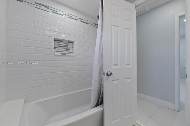 bathroom featuring shower / bath combo and tile patterned floors