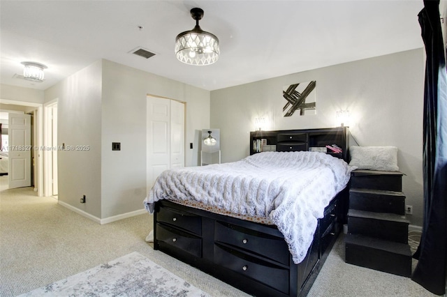 bedroom with light carpet and a closet