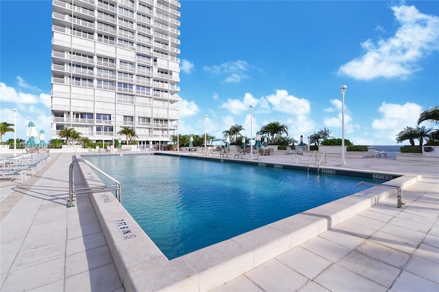 view of swimming pool with a patio