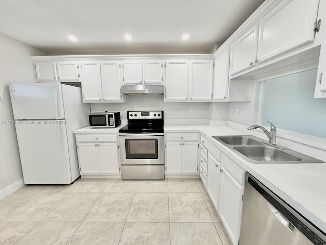 kitchen with white cabinets, light tile patterned floors, stainless steel appliances, and sink