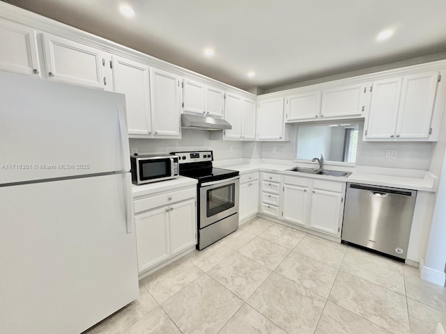 kitchen with white cabinets, light tile patterned floors, stainless steel appliances, and sink