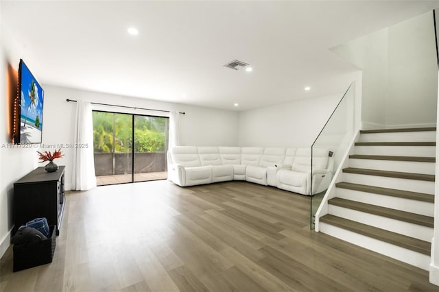 unfurnished living room featuring wood-type flooring