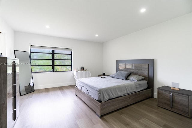 bedroom with light wood-type flooring