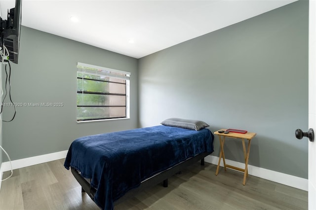 bedroom with wood-type flooring