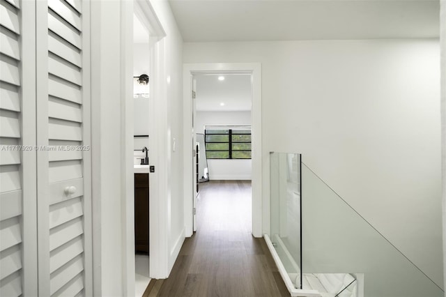 hallway featuring dark hardwood / wood-style floors