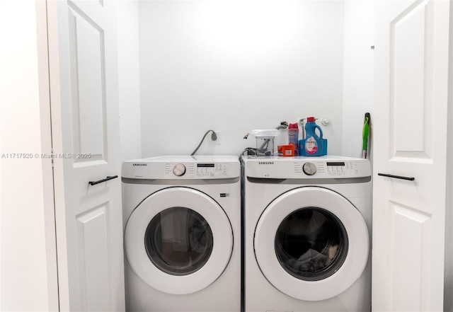 clothes washing area with independent washer and dryer