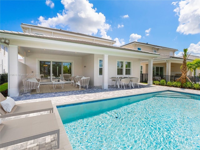 view of swimming pool featuring a patio