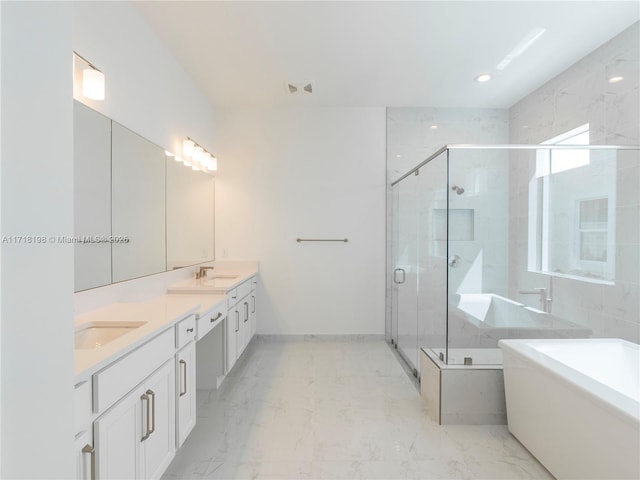 bathroom featuring vanity and a shower with door