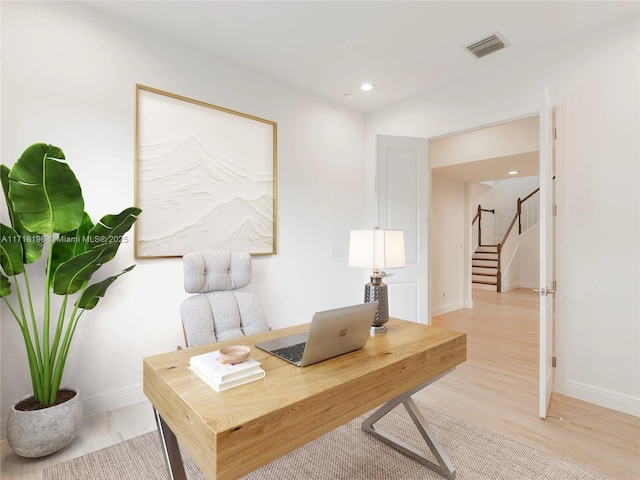 spare room featuring light wood-type flooring