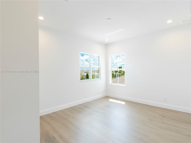 unfurnished bedroom with a closet and light wood-type flooring