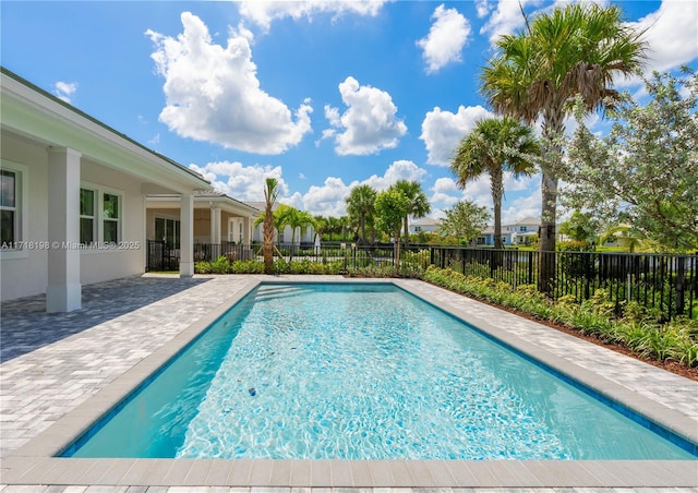 view of swimming pool featuring a patio area