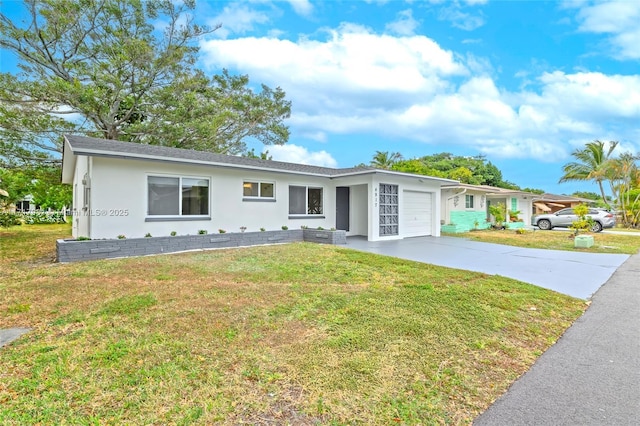 ranch-style home with a front yard and a garage