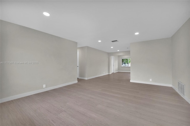 spare room with light wood-type flooring