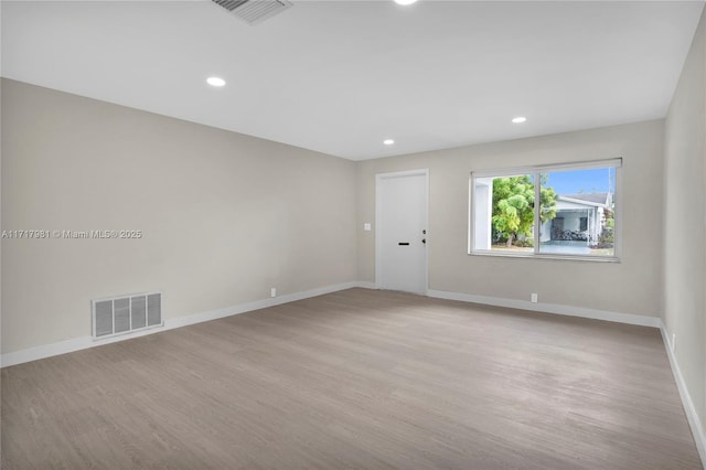 unfurnished room featuring light hardwood / wood-style floors