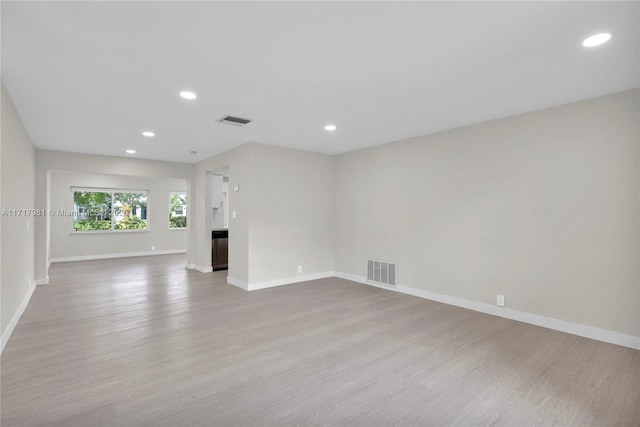 unfurnished living room featuring light hardwood / wood-style flooring