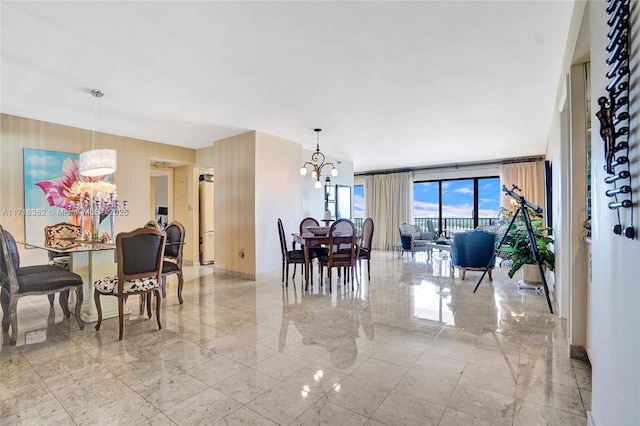 dining space featuring a wall of windows and a chandelier